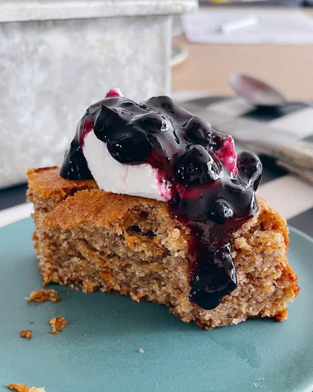 close up of almond butter banana snacking cake with yogurt and jam