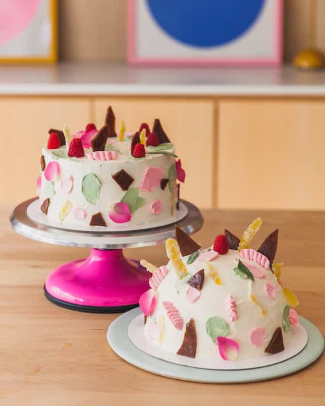 maximalist dome cake duo with toffee shards and edible flowers