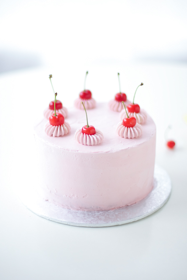 cherry topped pink buttercream cake - coco cake land