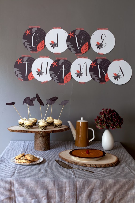 give thanks holiday sign with cupcakes and pumpkin pie and table decorations
