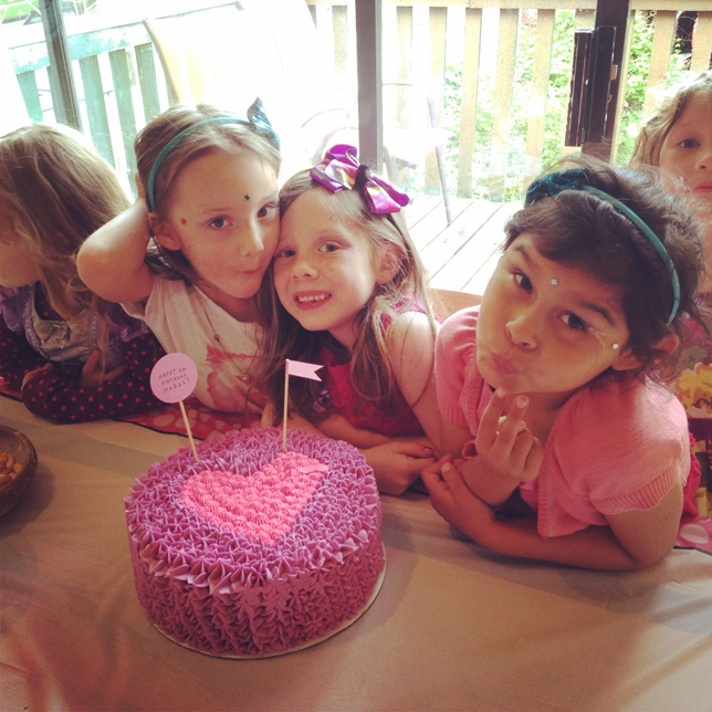 hazel the birthday girl with pink cake