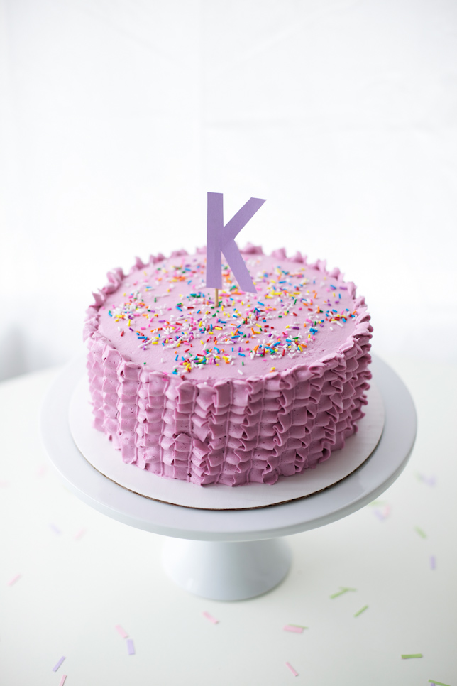 ruffle cake with sprinkles and letter topper - coco cake land