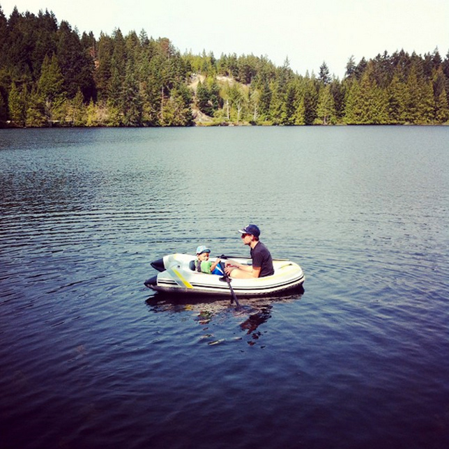 father son boat on a lake