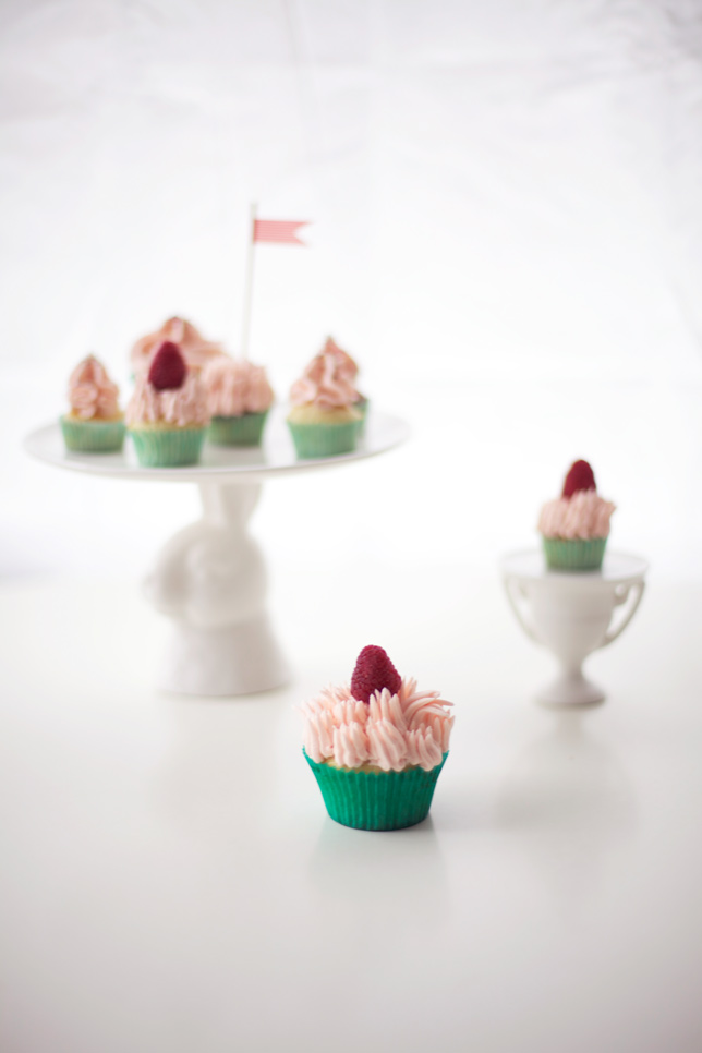 pink and green cupcakes on stands