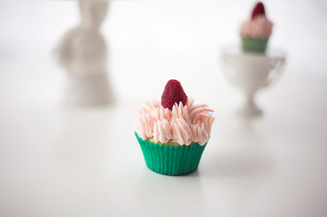 pink and green cupcake with raspberry