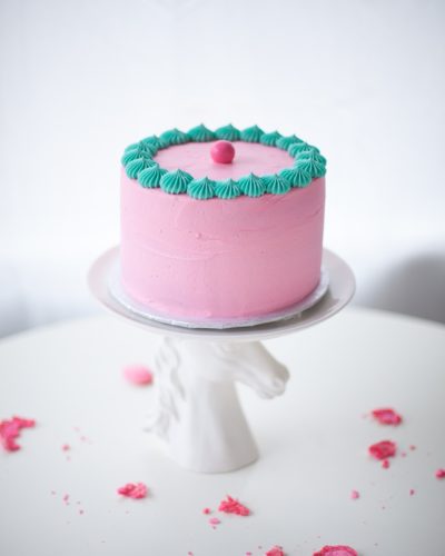 pink rainbow cake on horse cake stand - coco cake land
