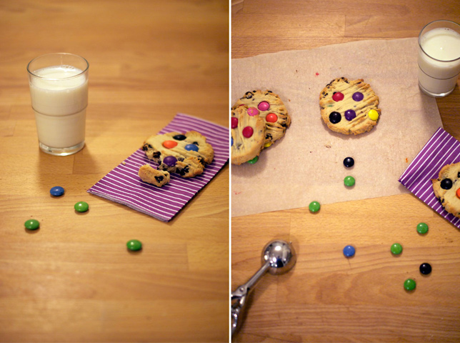 smartie cookies next to glass of milk