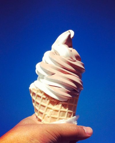 soft serve ice cream cone against blue sky