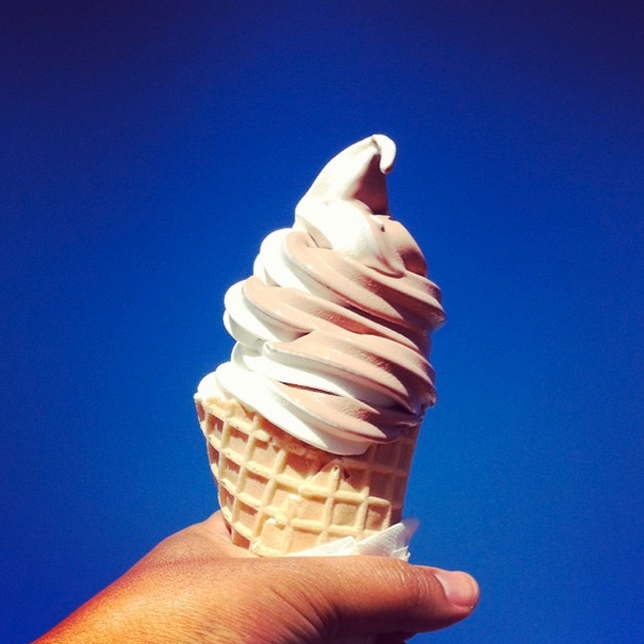 soft serve ice cream cone against blue sky