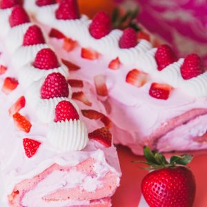 close up of pink strawberry swiss roll cake