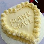 white frosted heart cake with hidden fake blood inside